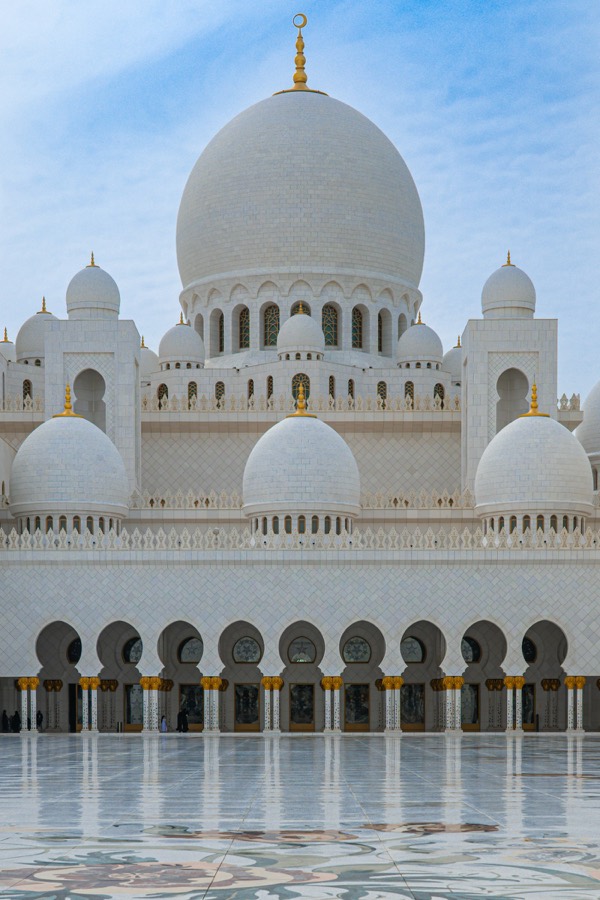 The white marble domes of the Sheikh Zayed Grand Mosque in Abu Dhabi